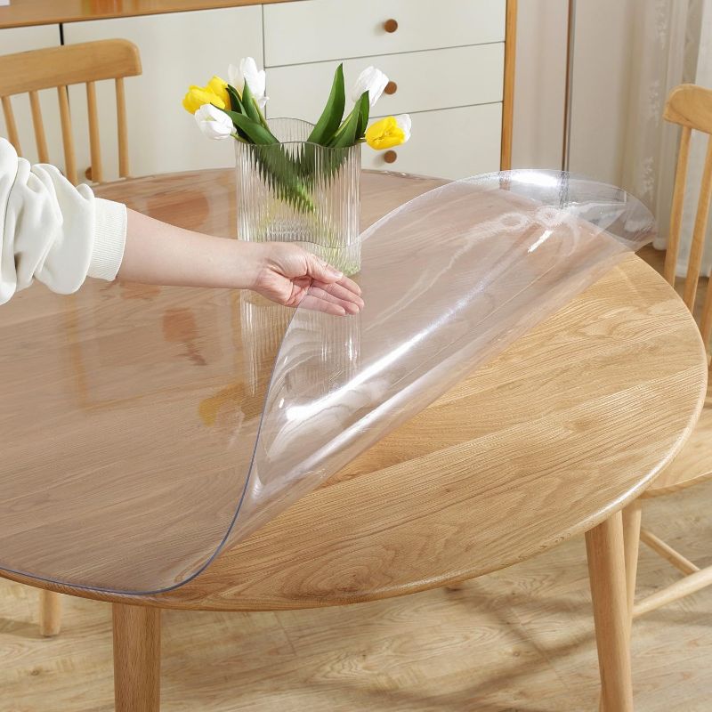 Photo 1 of  LovePads 2mm Thick Clear Round Table Cover Protector Clear Round Table Protector for Dining Room Table, Round Plastic Table Cover, Plastic Cover for Round Table, PVC Round Table Pads (UNSURE OF EXACT MEASURMENTS)