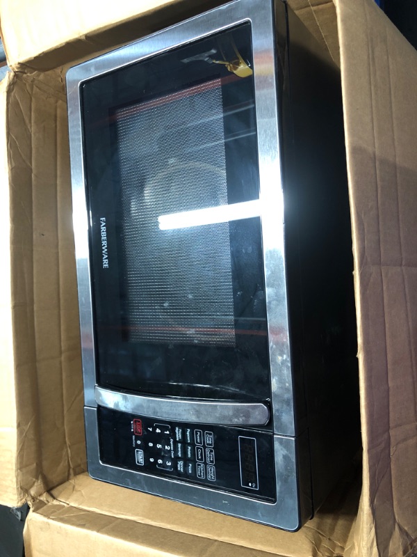 Photo 2 of **NONREFUNDABLE**FOR PARTS OR REPAIR**SEE NOTES**
Farberware Countertop Microwave 1000 Watts, 1.1 cu ft - Microwave Oven With LED Lighting and Child Lock - Perfect for Apartments and Dorms - Easy Clean Stainless Steel