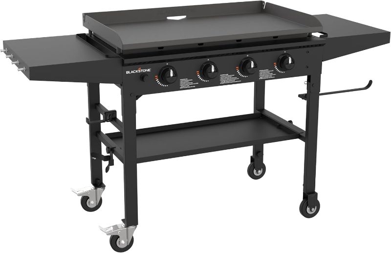 Photo 1 of ***USED - DAMAGED - MISSING PARTS - SEE COMMENTS***
Blackstone 1554 36" Omnivore Griddle with Folding Side Shelves, 36 Inch, Black