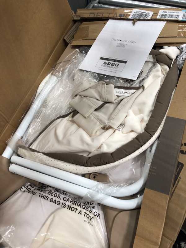 Photo 1 of Delta Children Rocking Bedside Bassinet - Portable Crib with Lights Sounds and Vibrations, Play Time Jungle