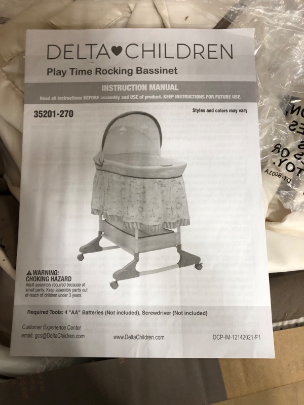 Photo 1 of Delta Children Rocking Bedside Bassinet - Portable Crib with Lights Sounds and Vibrations, Play Time Jungle