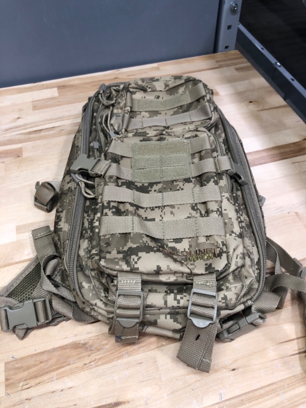 Photo 1 of Surge Tactical Hydration Pack by Fieldline | Military Backpack with MOLLE System | Survival Bug Out Bag | 22L Storage Capacity + 3L Reservoir Digital Sand