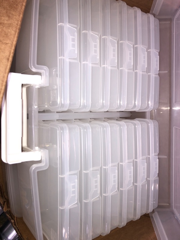 Photo 2 of 2 large plastic containers with 12 small plastic units inside 