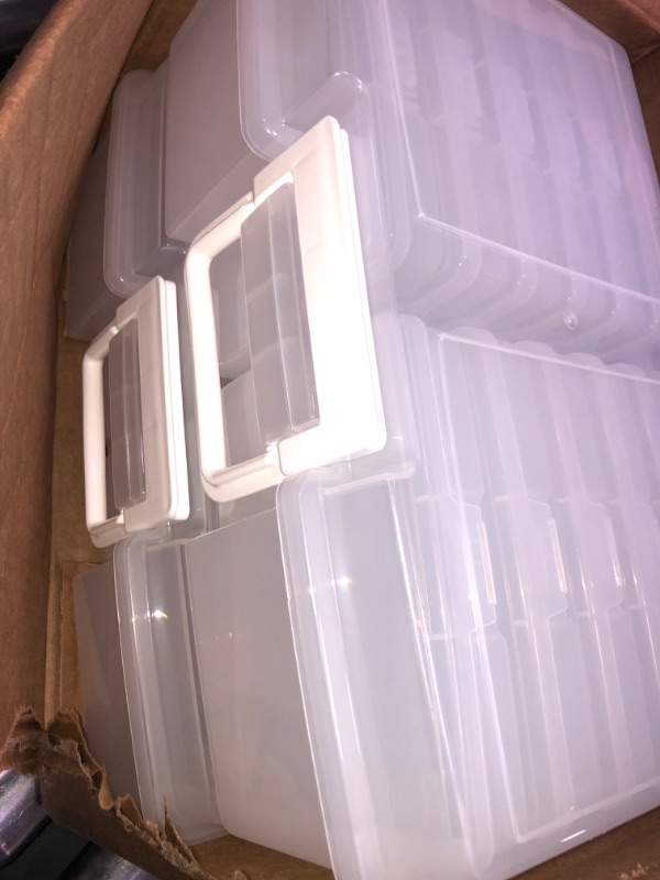 Photo 1 of 2 large plastic containers with 12 small plastic units inside 