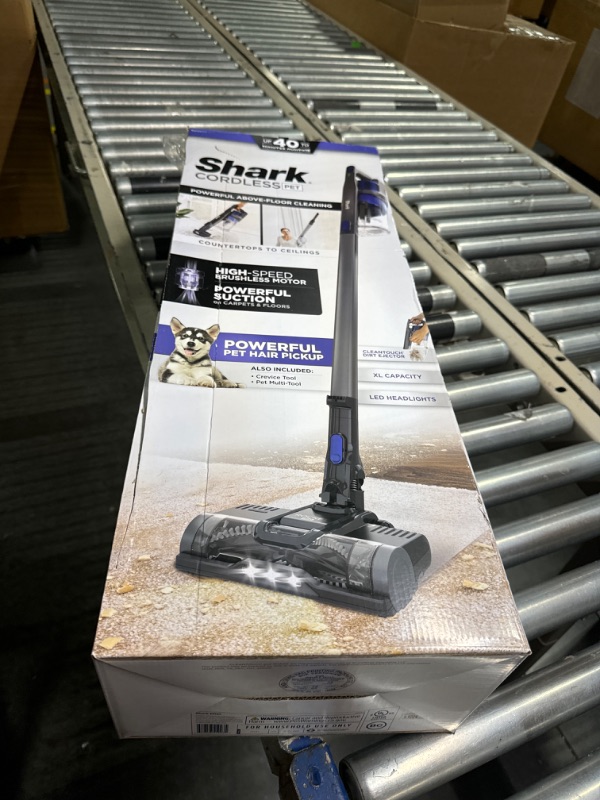 Photo 2 of ****USED*** Shark IX141 Pet Cordless Stick Vacuum with XL Dust Cup, LED Headlights, Removable Handheld Vac, Crevice Tool, Portable Vacuum for Household Pet Hair, Carpet and Hard Floors, 40min Runtime, Grey
