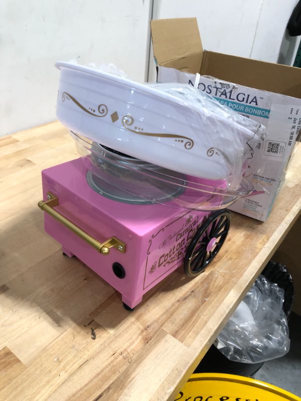 Photo 1 of **READ NOTES BEFORE PURCHASING ITEM** 
Nostalgia Retro Countertop Cotton Candy Machine, Vintage Candy Maker Includes 2 Reusable Cones & Scoop, Pink
**Item does NOT work-- NON-FUNCTIONAL** Can be used as DECOR**