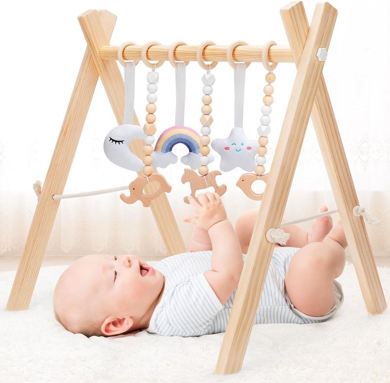 Photo 1 of KIZZYEA Wooden Baby Play Gym, Infant Activity Gym for 0-3-6-12 Months, Wooden Foldable Frame Bar, Baby Activity Center, Newborn Montessori Gift for Boys Girls Ages 0 Month+