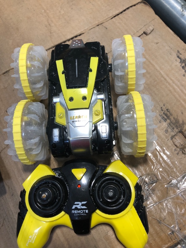 Photo 2 of ***used****Toys for 5-12 Year Old Boys Amphibious RC Car for Kids 2.4 GHz Remote Control Boat Waterproof RC Stunt Car Truck with LED Lights 4WD Remote Control Car Boy Girl Gifts All Terrain Water Beach Pool Toy Yellow