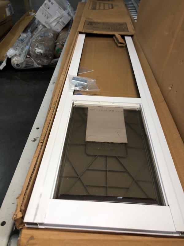 Photo 3 of ***USED - LIKELY MISSING PARTS - UNABLE TO VERIFY FUNCTIONALITY***
PetSafe 1-Piece Sliding Glass Pet Door for Dogs & Cats- Adjustable Height 75 7/8" to 81"-Medium, White, No-Cut DIY Install Aluminum Patio Panel Insert, Great for Renters or Seasonal Instal