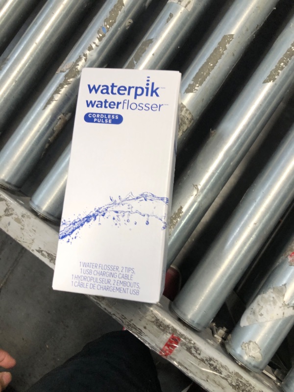 Photo 2 of **Like new 
Waterpik Cordless Pulse Rechargeable Portable Water Flosser for Teeth, Gums, Braces Care and Travel with 2 Flossing Tips, Waterproof, ADA Accepted, WF-20 White, Packaging May Vary White Flosser