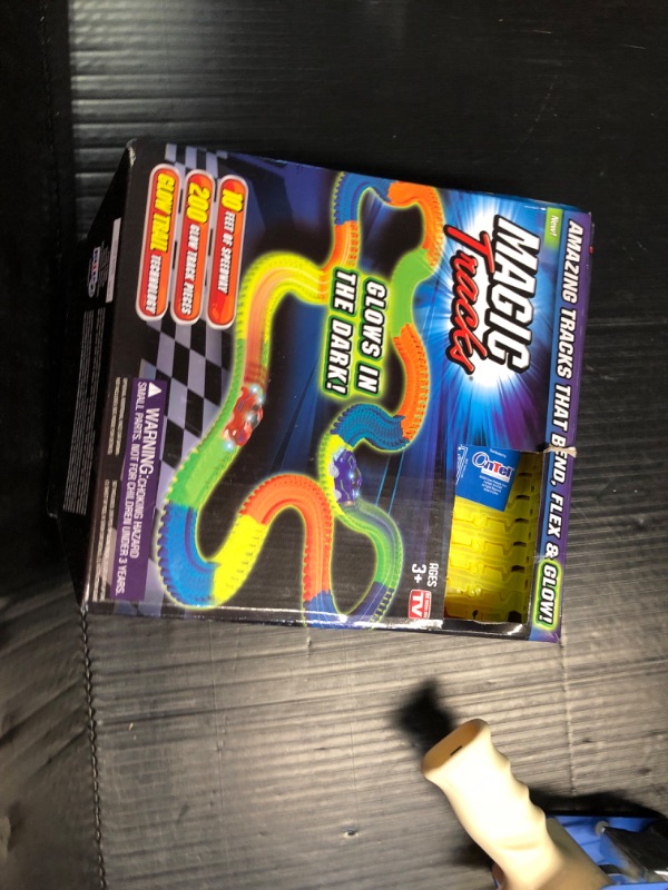 Photo 4 of ***USED - LIKELY MISSING PARTS - UNABLE TO VERIFY FUNCTIONALITY***
Ontel Magic Tracks 10 Foot Glow In The Dark Bendable Flexible Racetrack with LED Light-Up Race Car, Educational Playset Birthday Gift for Ages 3+