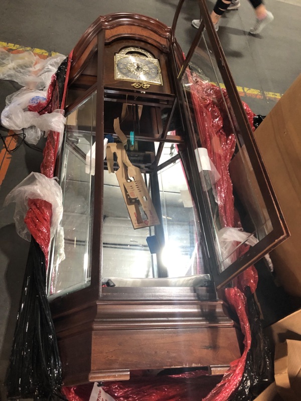 Photo 7 of **GLASS FACE OF CLOCK IS BROKEN. GLASS BROKEN THROUGHOUT. DAMAGED NEAR BOTTOM*SEE NOTES**Howard Miller Liskov Floor Clock II 549-028 – Large Windsor Cherry Curio Cabinet with Cable-Drive, Triple-Chime Movement with Volume Control
