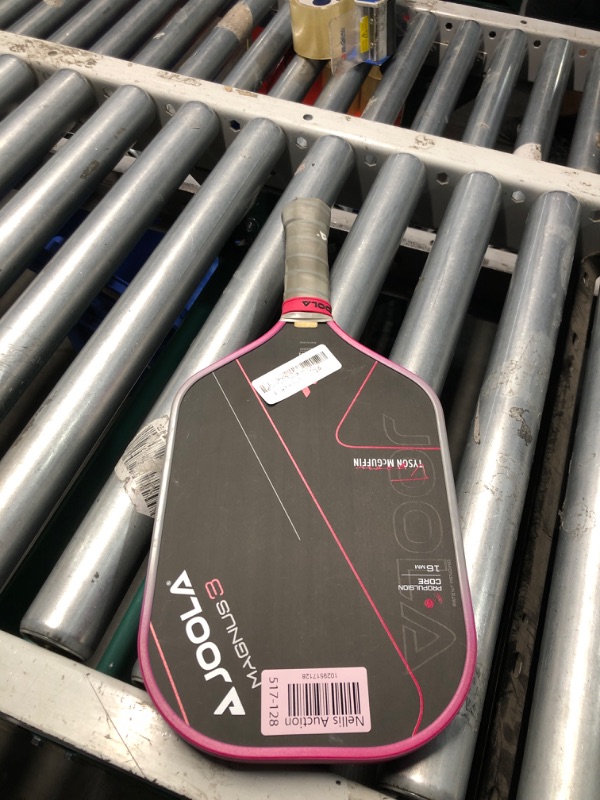 Photo 2 of **MINOR DAMAGE PREV USED**
JOOLA Tyson McGuffin Magnus 3 16mm Pickleball Paddle with 1 Replacement Grip - Elongated Short Handle Pickleball Paddle - Charged Carbon Surface Technology - Carbon Fiber Racket, Hot Pink Edge Guard