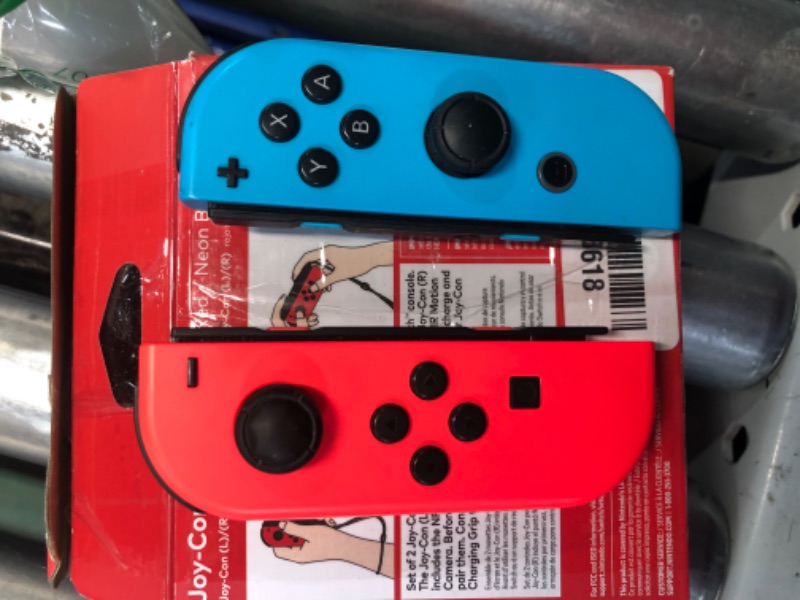 Photo 5 of ***USED - UNABLE TO TEST - NO ACCESSORIES***
Nintendo Joy-Con (L/R) - Neon Red/Neon Blue