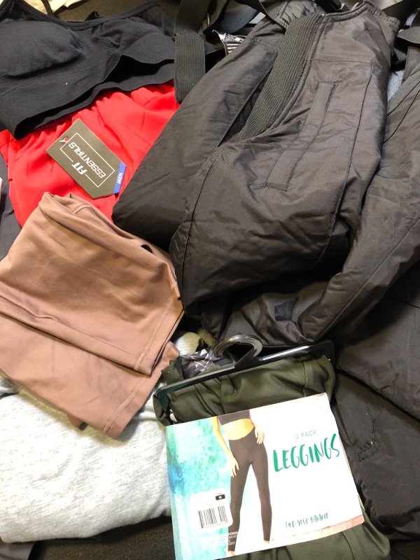 Photo 3 of clothing box lot clothing is new but stained sizing colors and style vary per item no returns or exchanges sports bra pink leggings nike etc ;  LEVIS