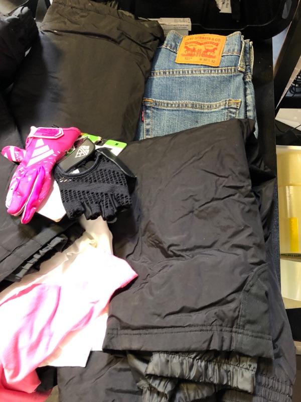 Photo 5 of clothing box lot clothing is new but stained sizing colors and style vary per item no returns or exchanges sports bra pink leggings nike etc ;  LEVIS