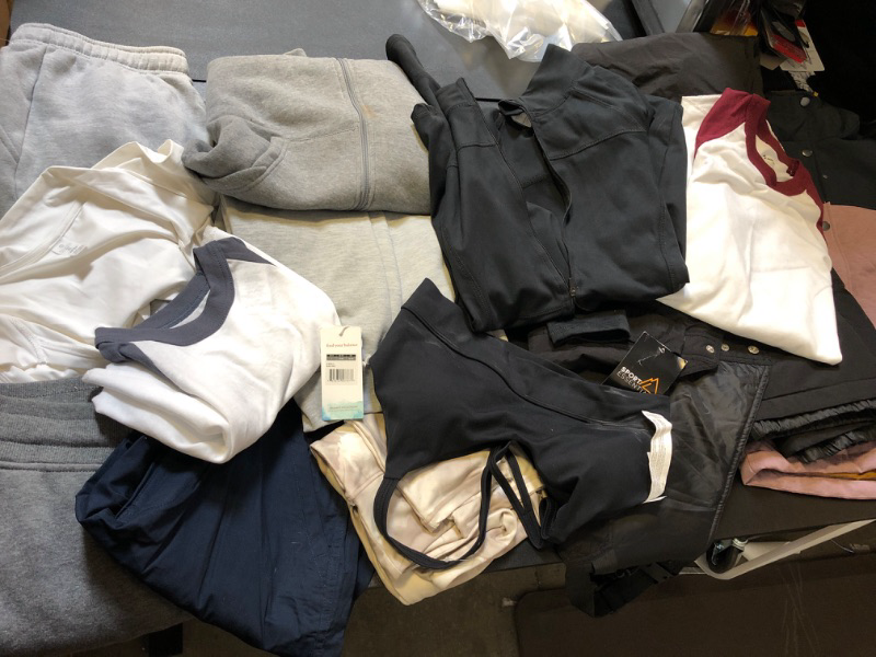 Photo 1 of clothing bAG lot clothing is new/ USED  but stained sizing colors and style vary per item no returns or exchanges sports bra SWEATS STAINS ON ZIP UP BLACK BBL JACKET XL BASEBALL TEES 