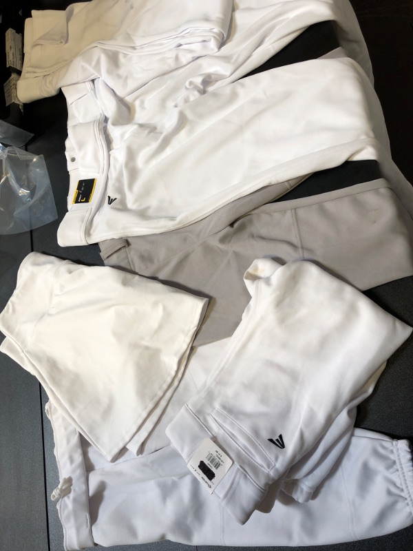 Photo 1 of WHITE CLOTHING MYSTERY BAG LOT USED AND STAINED COMES WITH A SKIRT AND BASEBALL PANTS YOUTH ADULT ETC NO RETURNS OR EXCHANGES 