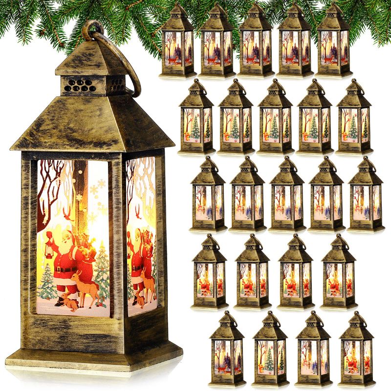 Photo 1 of 24 Pcs Christmas Decorative Lantern with LED Candle Christmas Mini Vintage Lantern Santa Claus Reindeer Xmas Tree Hanging Lantern for Indoor Outdoor Christmas Holiday Party Decor