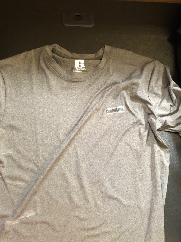 Photo 1 of gray work out shirt  sze L