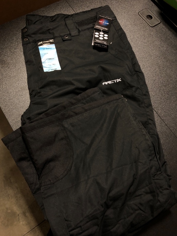Photo 2 of Arctix Women's Snow Sports Insulated Cargo Pants, Black, 31 seam 
