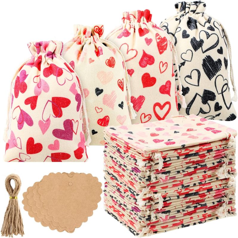 Photo 1 of 12 Pcs Valentine's Day Gift Bags Burlap Bags 5x7 Inch Valentine's Heart Gift Bags for Kids with 20 Pcs Kraft Paper Tags Drawstring Gift Bags Gift for Valentines Day Weddings Bridal Showers Anniversary
