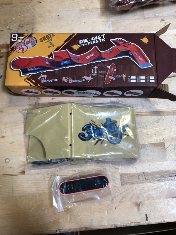 Photo 1 of DIE CAST WITH PLASTIC FINGER SKATEBOARD 