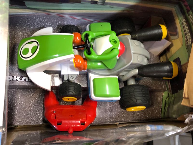 Photo 2 of Carrera 200988 RC Official Licensed Mario Kart Pipe Kart Yoshi 1:18 Scale 2.4 GHz Remote Radio Control Car with Rechargeable LiFePO4 Battery - Kids Toys Boys/Girls
