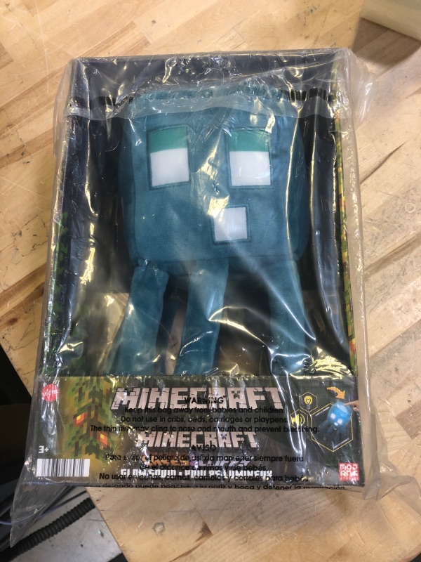 Photo 2 of Mattel Minecraft Glow Squid Plush Figure with Lights & Sounds, Glow-in-The-Dark Soft Toy Based on Video Game, Collectible Gift for Fans Age 3 Years & Older