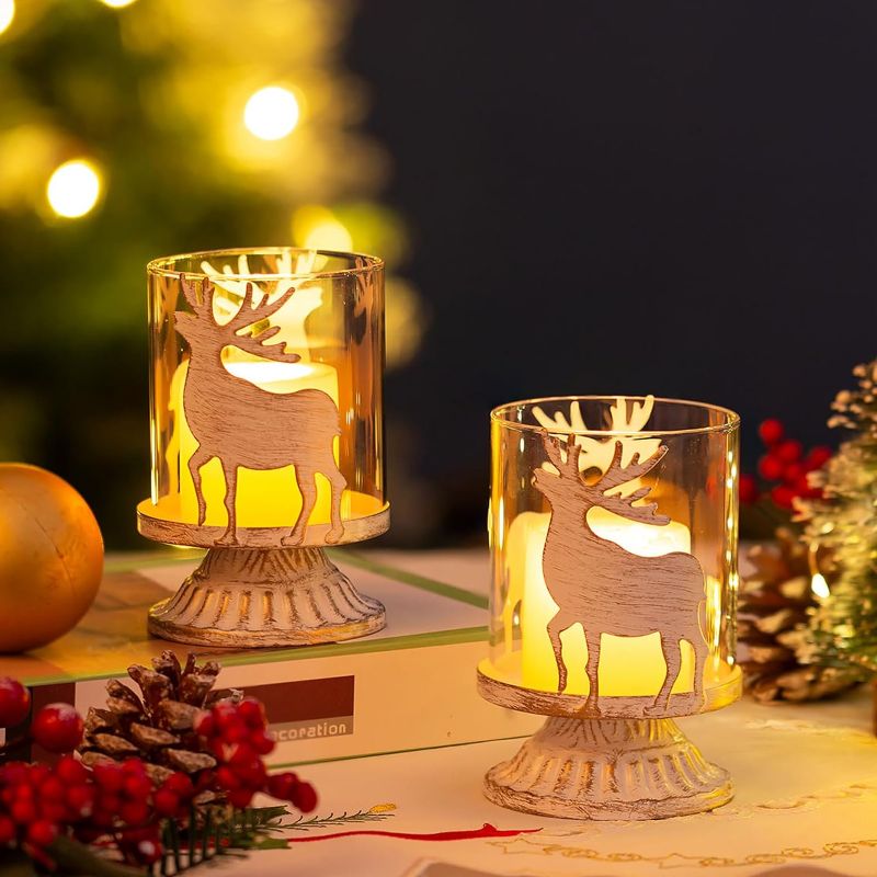 Photo 1 of Romadedi Christmas Pillar Candle Holder: Set of 2 Small Rustic Table Decorations with Distressed Metal Reindeer Design, Candle Holders Centerpieces Ornaments for Shelf Bookcase Farmhouse Home Decor
