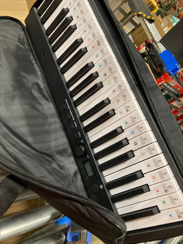 Photo 1 of ***NOT FUNCTIONAL****  ***SELLING AS PARTS NO RETURNS***

Finger Dance Folding Piano Electric Piano Keyboard with Stand Full Size Upgrade Wood Grain Touch Sensitive 88 Keys Digital Piano with Bluetooth MIDI Portable Piano Keyboard for Beginners ?Deep Blac