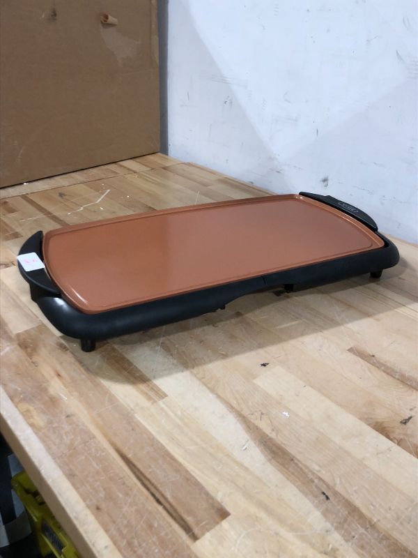 Photo 2 of *** SELLING AS PARTS NO RETURN AS IS***
**READ NOTES BEFORE PURCHASING ITEM** 
BELLA Griddle Ceramic Copper TI, Healthy-Eco Non-stick Coating, Hassle-Free Clean Up, Large Submersible Cooking Surface, 10" x 16", Copper/Black Copper/Black 10" x 16"