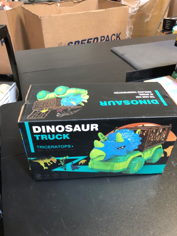 Photo 2 of TEMI Dinosaur Truck Toy for Kids 3-5 Years, Triceratops Transport Car Carrier Truck with 8 Dino Figures, Activity Play Mat, Dino Eggs and Trees, Capture Jurassic Dinosaur Play Set for Boys and Girls Triceratops Dino Truck