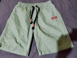 Photo 2 of mens size small faux supreme shorts