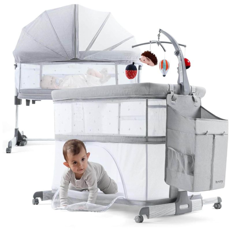 Photo 1 of Besrey 5-in-1 Baby Bassinet Bedside Sleeper with Playpen, Mobile Toy Hanger, Hanging Diaper Bag, and Mattress