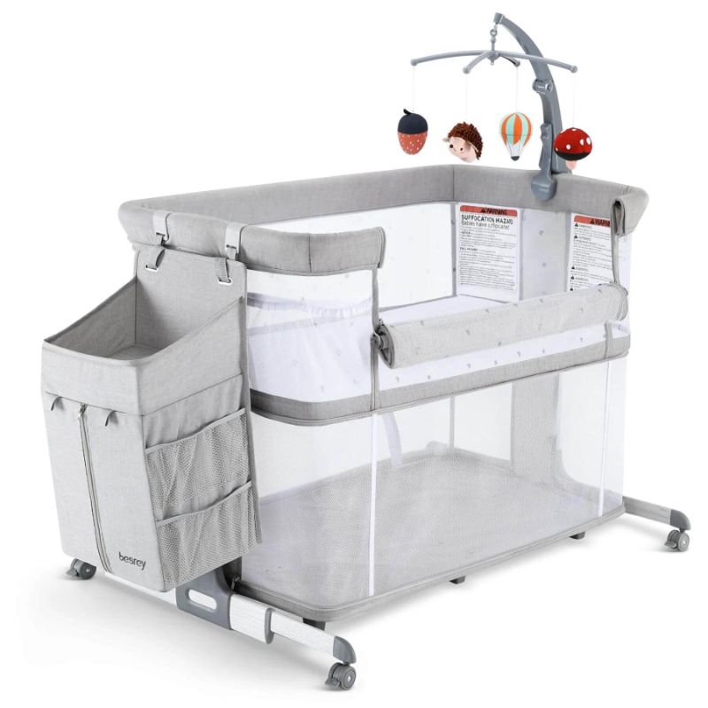 Photo 2 of Besrey 5-in-1 Baby Bassinet Bedside Sleeper with Playpen, Mobile Toy Hanger, Hanging Diaper Bag, and Mattress