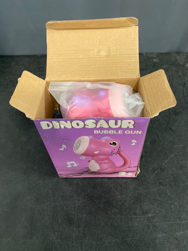 Photo 2 of Dinosaur Bubble Machine, Dino Bubble Wand for Kids, Musical & Light Up Fun Bubble Gun Blower, Cool Outdoor Dinosaur Toys for Kid, Birthday Gifts for Ages 3 4 5 6 7 8 Year Boys & Girls (Purple)