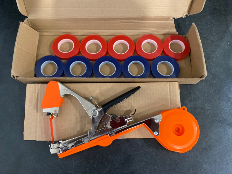 Photo 2 of (Does Not Come With Staples) Plant Tying Machine, Gardening Tape tool with 10 Rolls of Tape for Vegetable, Grape, Tomato, Cucumber, Pepper and Flower (Orange)