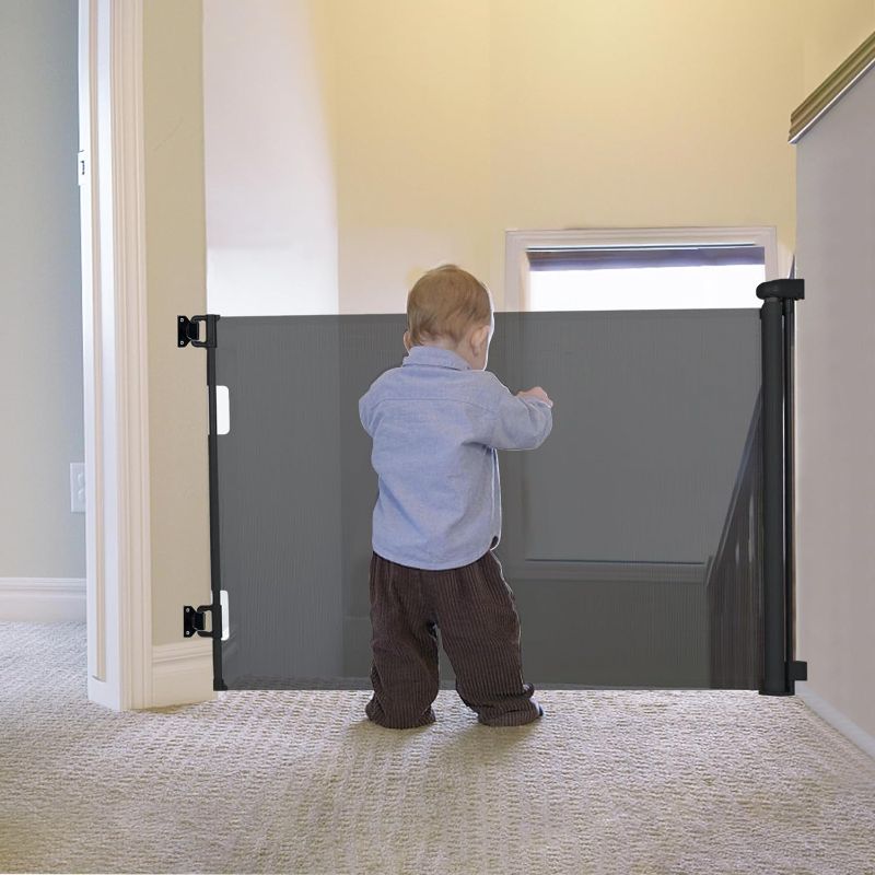 Photo 1 of 1 Black Retractable Baby Gate Indoor Outdoor Safety Gate for Baby and Dog Gate Extends to 55'' Wide 35'' Tall Child Safety Gate Mesh Gate for Stairs, Door