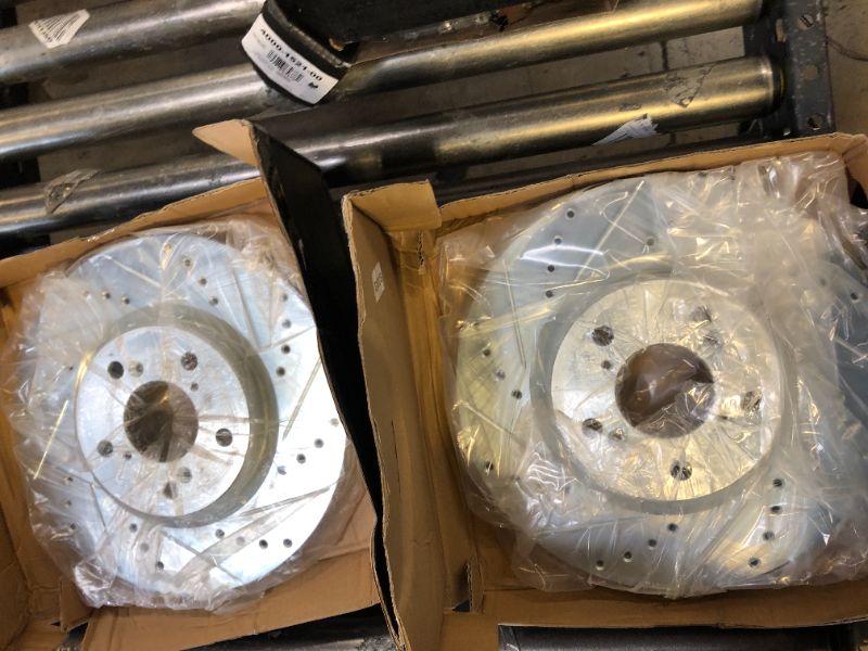 Photo 1 of Dynamic Friction 631-59056L and 631-59056R - Drilled and Slotted Silver Zinc Brake Rotor