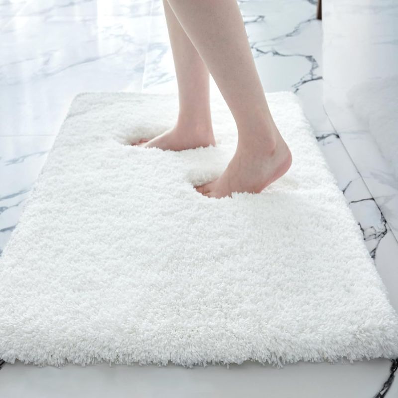 Photo 1 of White Bath Mat 24x36in Washable Non Slip Bath Rug for Bathroom Floor Soft Absorbent Plush Shower Mat for Tub Modern Luxury Bathroom Carpet
