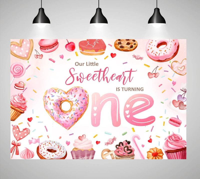Photo 1 of Valentine Donut 1st Birthday Backdrop for Girls Sweetheart Donut Grow Up First Birthday Party Photo Decorations Our Little Sweetheart is Turning One Party Banner Supplies 7x5ft
