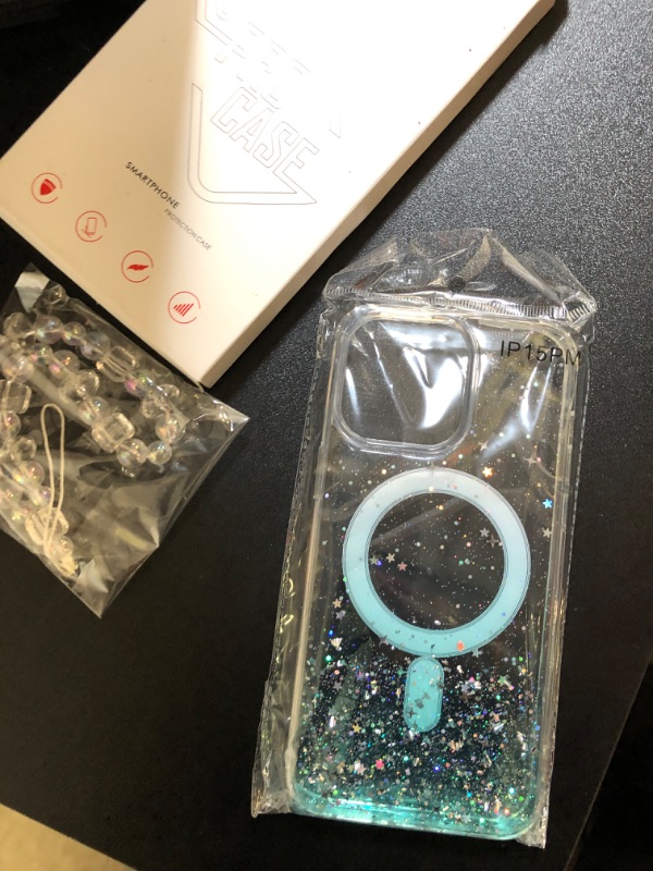 Photo 1 of clear iphone 15 pro max phone case blue glitter 