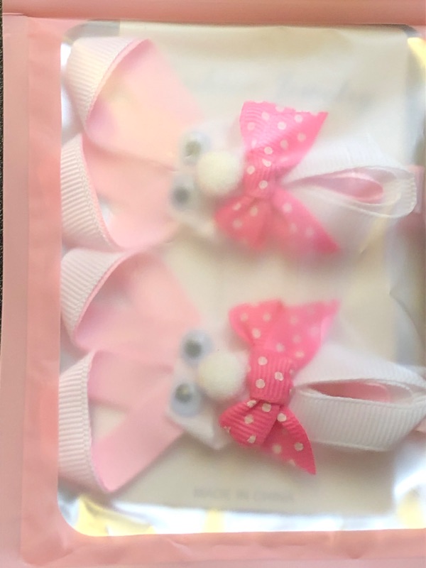 Photo 1 of bunny pink and white hair bows 