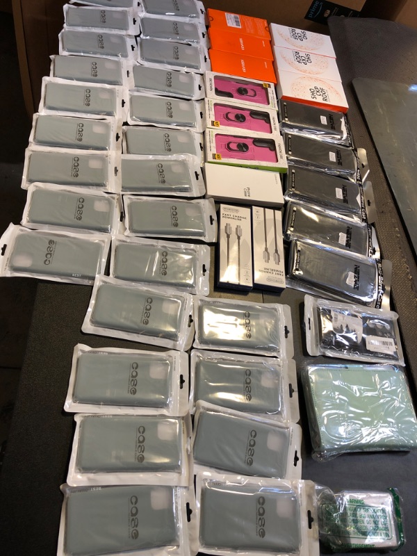 Photo 1 of phone case mystery box lot sold as is no returns or exchanges styles color and sizing does vary on the item includes chargers  pink teal and black 