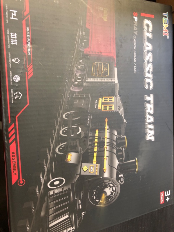 Photo 1 of Electric Rechargeable Train Toy with Steam Engine for Kids 3 4 5 6 7+ Years Old, Model Train Set, Light and Sounds for Boys & Girls Black