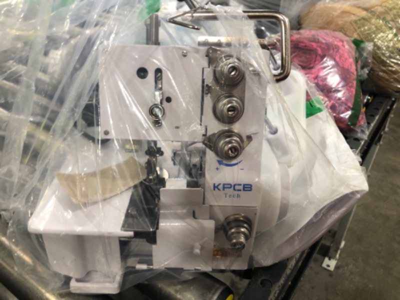 Photo 1 of Brother Serger, 1034D, Heavy-Duty Metal Frame Overlock Machine, 1,300 Stitches Per Minute, Removeable Trim Trap, 3 Included Accessory Feet, White Overlock Machine 1034D