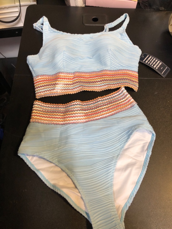 Photo 1 of WOMENS TWO PIECE SWIMSUIT SET 
SIZE SMALL 
