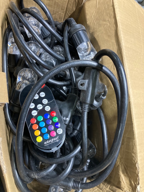 Photo 1 of ***DAMAGE BOX / DIRTY AND USED*** Enbrighten Premium Color Changing String Lights, 48ft Black Cord, 24 Shatterproof Acrylic Bulbs, Weatherproof, Remote Control, Dimmable RGB LED, Outdoor String Lights, 37790 Black Cord 48ft Remote Controlled