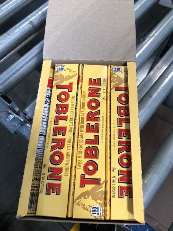 Photo 1 of ***USED***EXPIRES:: NOV 2024*** Toblerone Milk Chocolate Bar with Honey and Almond Nougat, 12 - 3.52 oz Bars Milk Chocolate 3.52 Ounce Bar (Pack of 12)